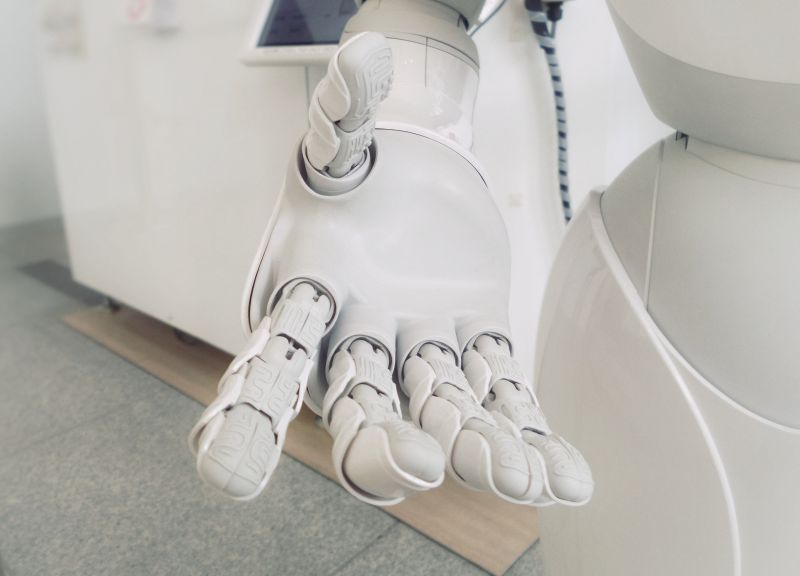 robot's outstretched hand representing ai and seo